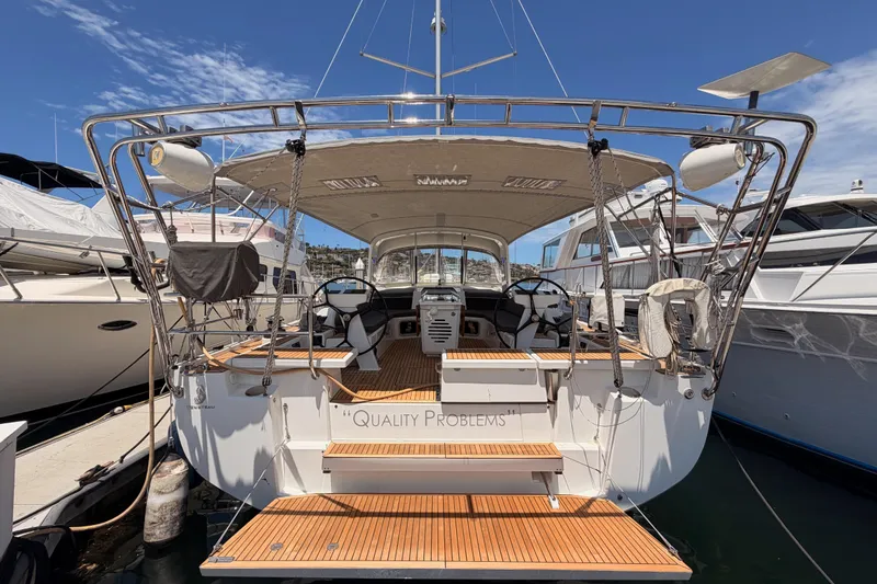Slide: The Image of Beneteau Oceanis 51.1 yacht, 2020 model, docked at marina with open cockpit view. - 4