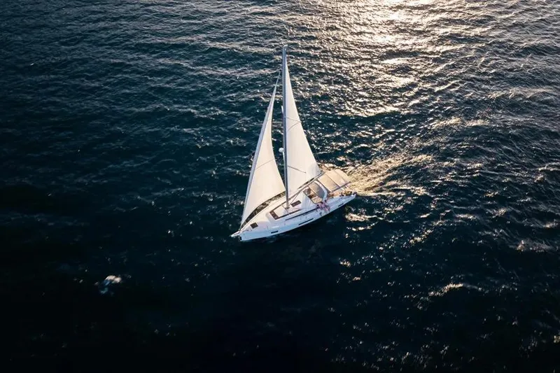 Slide: The Image of Aerial view of 2020 Beneteau Oceanis 51.1 sailing on open water. - 1