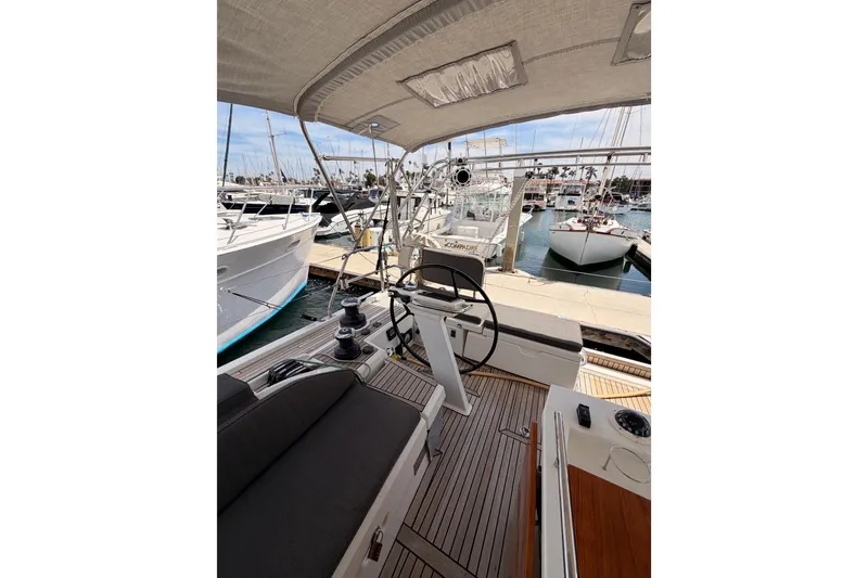 Slide: The Image of Cockpit view of 2020 Beneteau Oceanis 51.1 yacht docked at marina. - 26
