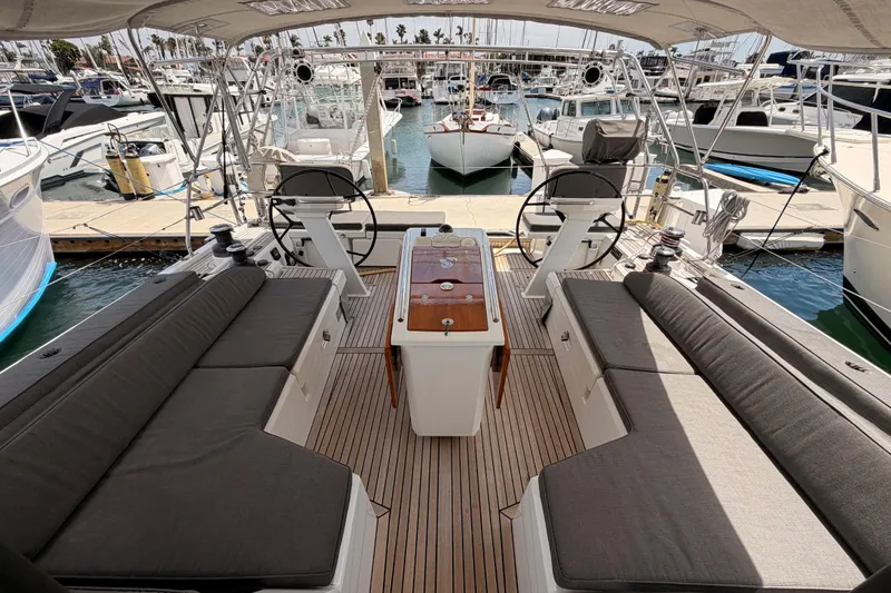 Slide: The Image of Spacious cockpit of 2020 Beneteau Oceanis 51.1 yacht docked at marina. - 25
