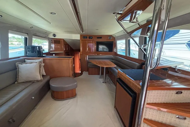 Slide: The Image of Luxurious interior of 2007 Riviera 51 Enclosed Flybridge yacht with modern furnishings. - 10
