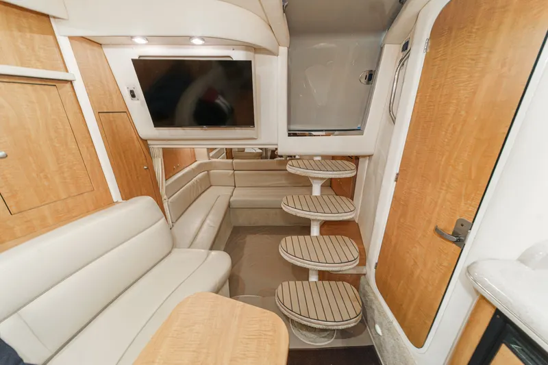 Slide: The Image of Interior of a 2006 Sea Ray 340 Sundancer with elegant wood accents and comfortable seating. - 31