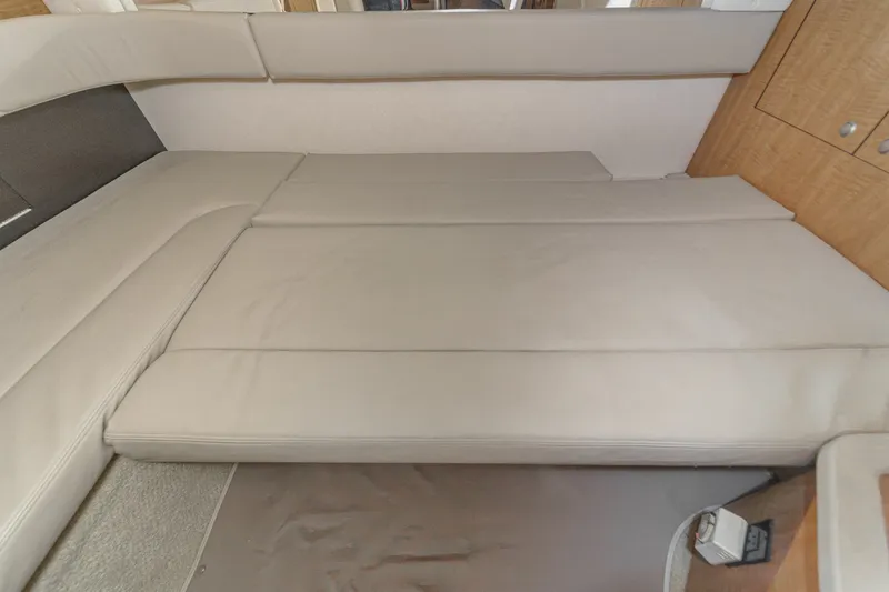 Slide: The Image of Interior of a 2006 Sea Ray 340 Sundancer with beige upholstery. - 34