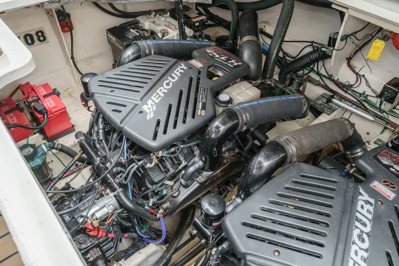 Slide: The Image of Engine room of a 2006 Sea Ray 340 Sundancer with twin Mercury engines and batteries. - 38