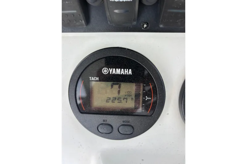 Slide: The Image of Yamaha tachometer on 2015 Sea Hunt Ultra 235 SE boat dashboard, displaying 2257 hours. - 26