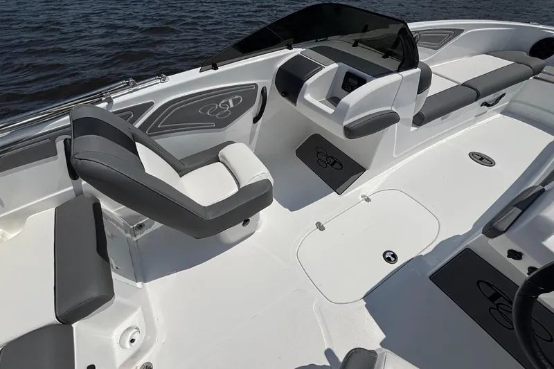 Slide: The Image of 2024 Tahoe T21 boat interior with sleek seating and modern dashboard design. - 12
