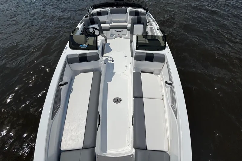 Slide: The Image of 2024 Tahoe T21 boat with spacious seating on calm water. - 14