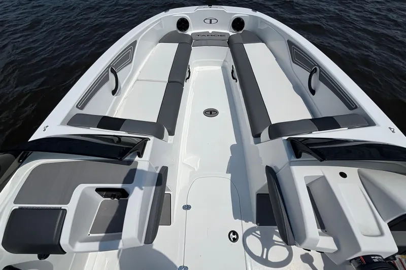 Slide: The Image of 2024 Tahoe T21 boat interior with sleek seating and modern design on the water. - 6