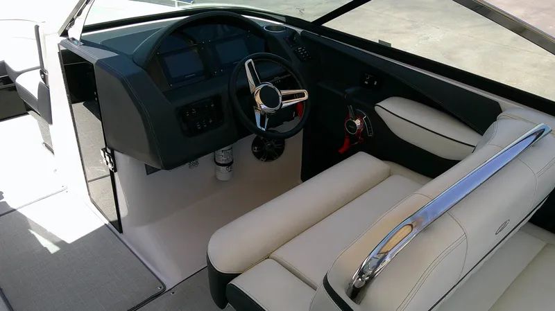 Slide: The Image of The image shows the cockpit of a 2020 Regal 2800 Bowrider with a sleek steering wheel and comfortable seating. - 9