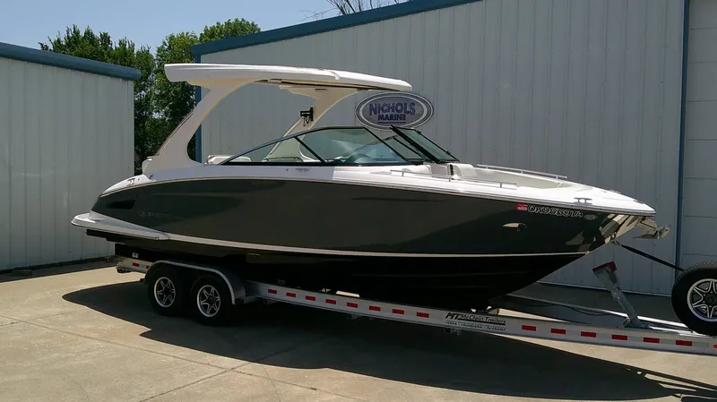 Slide: The Image of A 2020 Regal 2800 Bowrider on a trailer, parked outside a building. - 3