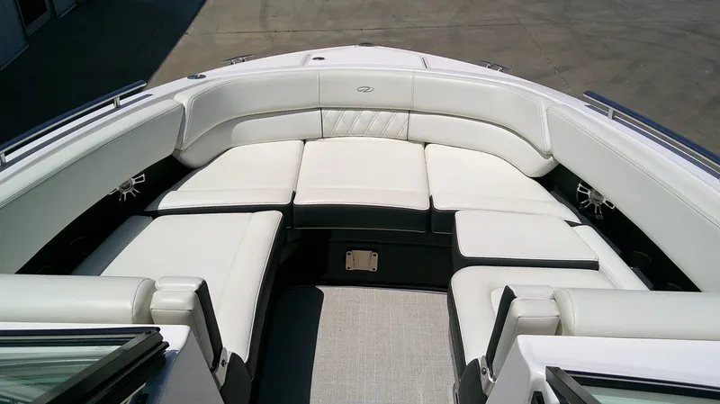 Slide: The Image of The image shows the bow area of a 2020 Regal 2800 Bowrider with white upholstery. - 15