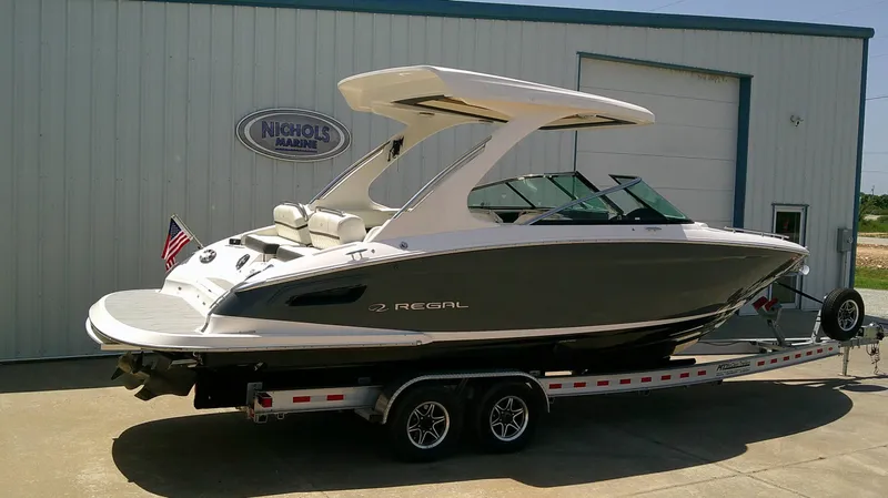 Slide: The Image of A 2020 Regal 2800 Bowrider on a trailer in front of a building. - 4