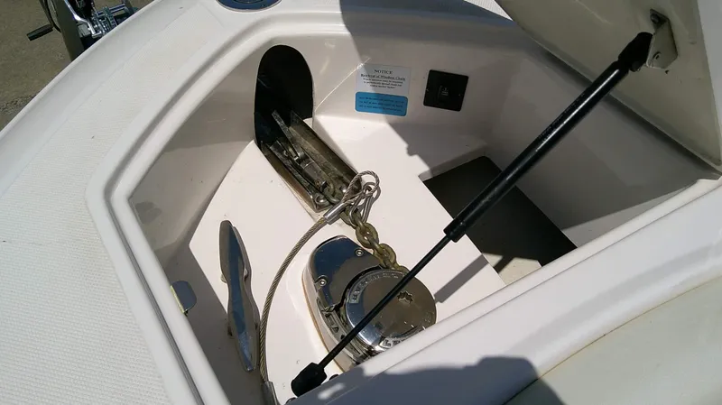 Slide: The Image of An anchor locker on a Regal 2800 Bowrider boat with anchor and chain. - 16