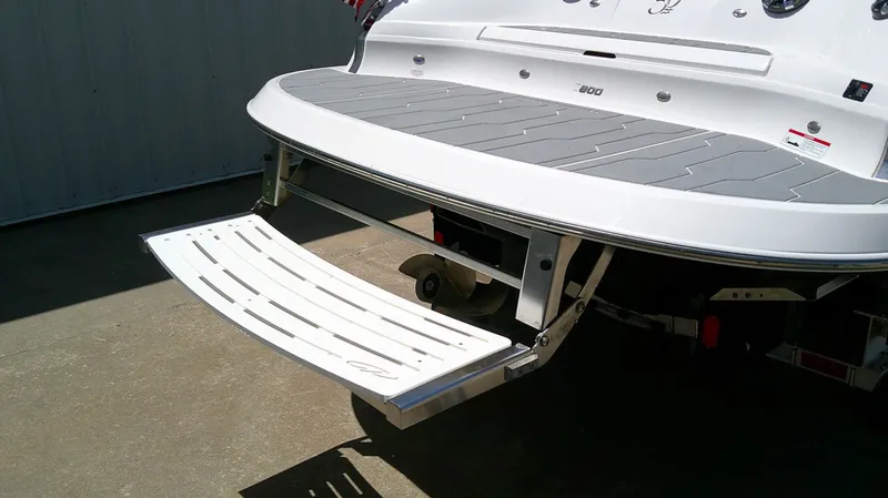 Slide: The Image of The image shows the stern of a 2020 Regal 2800 Bowrider with a fold-out swim platform. - 17