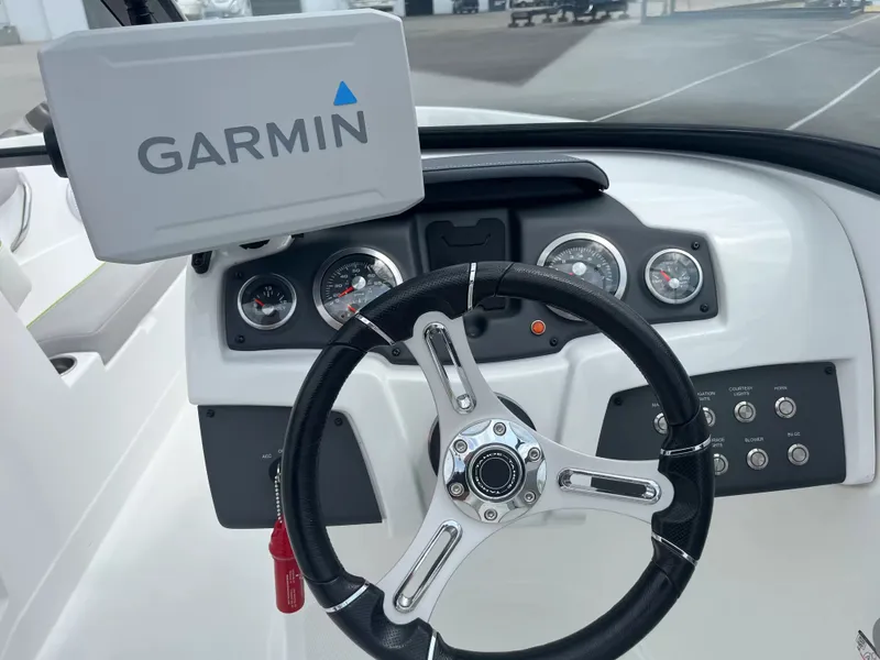 Slide: The Image of The image shows the helm of a 2018 Tracker TAHOE 700 MOK with Garmin navigation. - 14