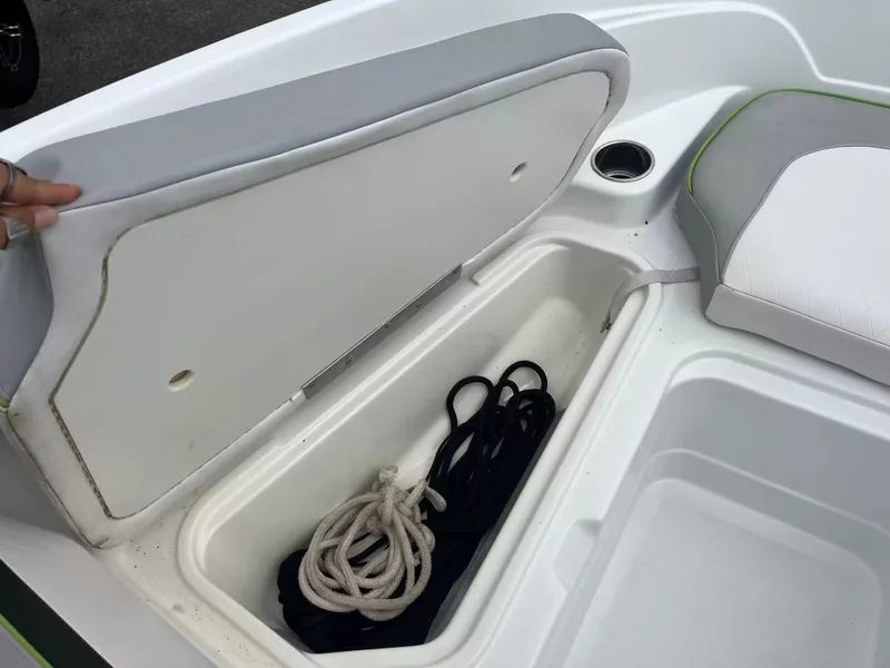 Slide: The Image of An open storage compartment on a boat with ropes inside. - 16