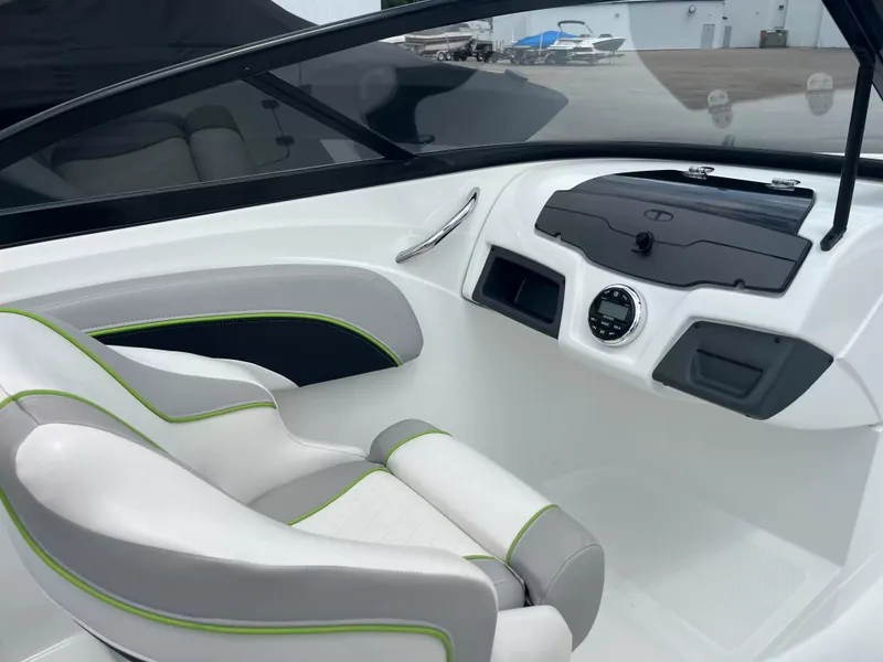 Slide: The Image of The image shows the cockpit of a 2018 Tracker TAHOE 700 MOK with modern seating and controls. - 13