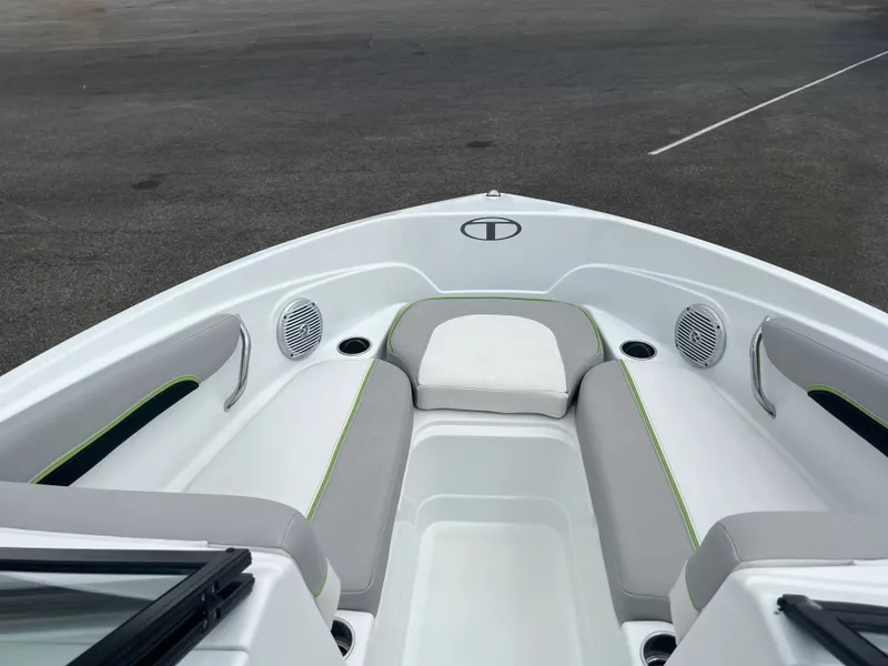 Slide: The Image of The image shows the bow of a 2018 Tracker TAHOE 700 MOK with gray and white upholstery. - 19