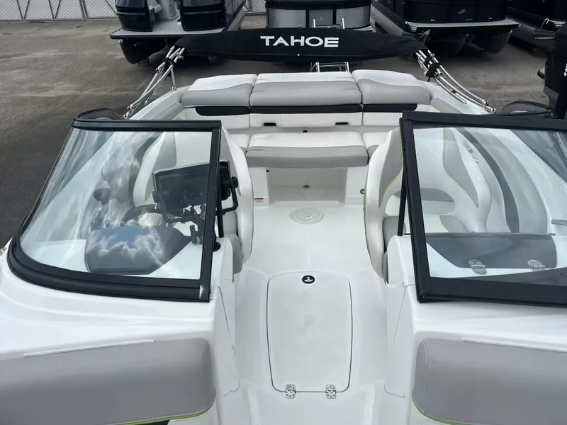 Slide: The Image of The image shows the cockpit of a 2018 Tracker TAHOE 700 MOK with modern seating and controls. - 20