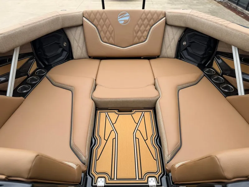 Slide: The Image of The image shows the luxurious interior of a 2027 Tigé 24RZX boat with beige upholstery. - 20