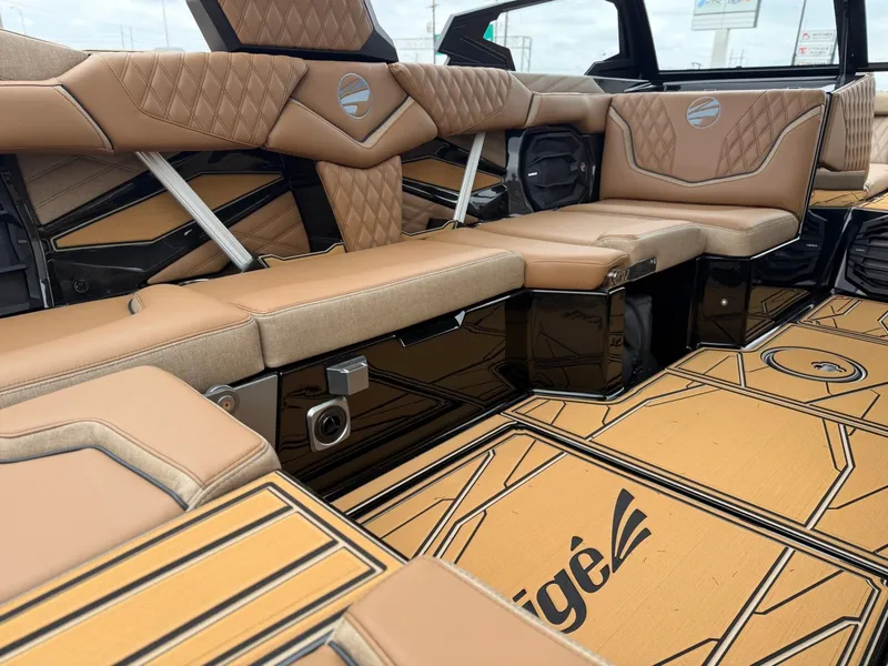Slide: The Image of The image shows the luxurious interior of a Tigé 24RZX boat with elegant, upholstered seating. - 14