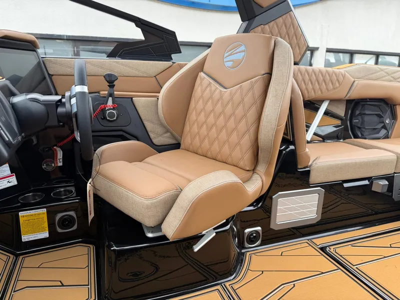 Slide: The Image of The interior of a 2027 Tigé 24RZX features luxurious beige leather seats with diamond stitching. - 17