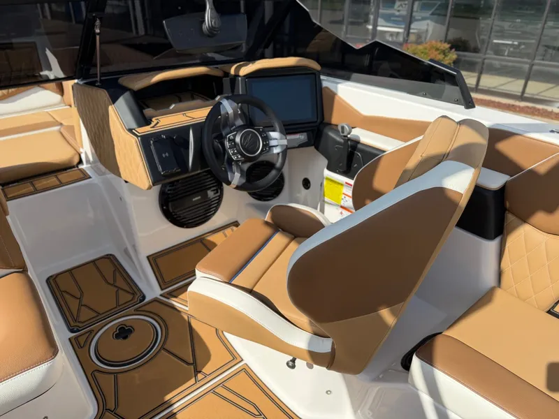 Slide: The Image of The image shows the cockpit of a 2027 Tigé Z1 with modern controls and beige seating. - 15