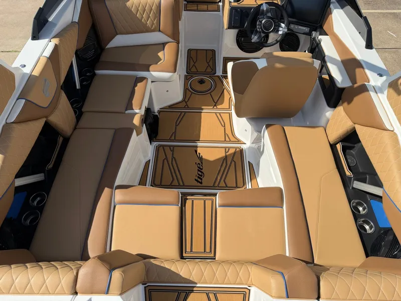 Slide: The Image of The image shows the interior of a 2027 Tigé Z1 boat with sleek brown upholstery. - 8