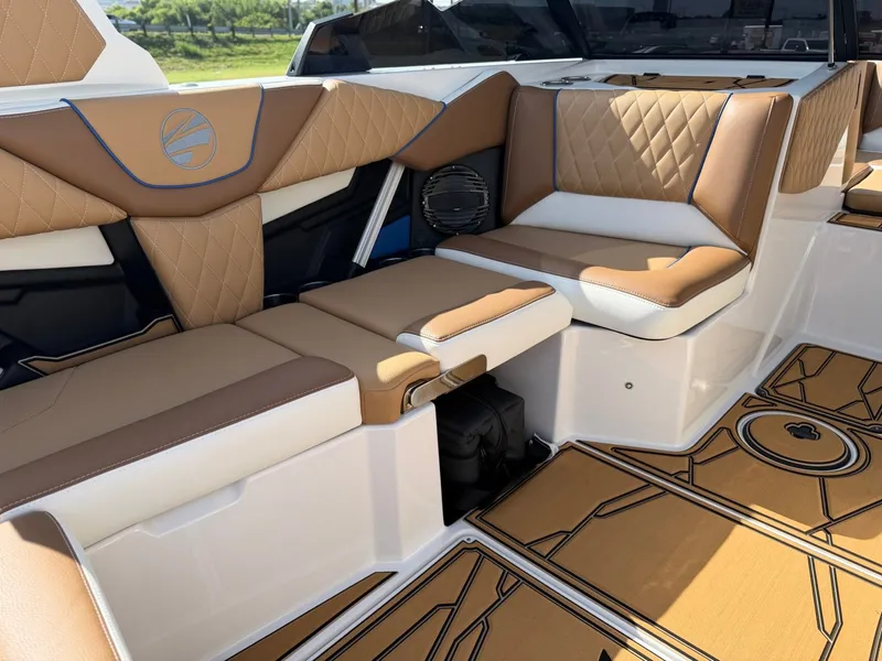 Slide: The Image of The image shows the luxurious interior of a 2027 Tigé Z1 boat with elegant, quilted seating. - 13