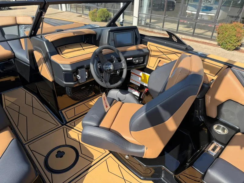 Slide: The Image of The image shows the cockpit of a 2027 ATX Surf Boats 22 Type-S with modern controls. - 15