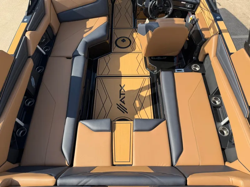 Slide: The Image of Interior of a 2027 ATX Surf Boats 22 Type-S with brown and black upholstery. - 8