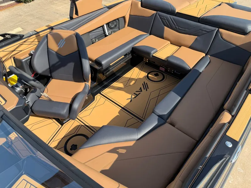 Slide: The Image of The image shows the interior of a 2027 ATX Surf Boats 22 Type-S with stylish brown and black seating. - 19