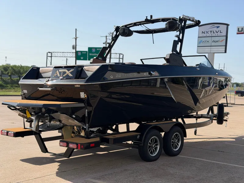 Slide: The Image of A 2027 ATX Surf Boat 22 Type-S on a trailer in a parking lot. - 5