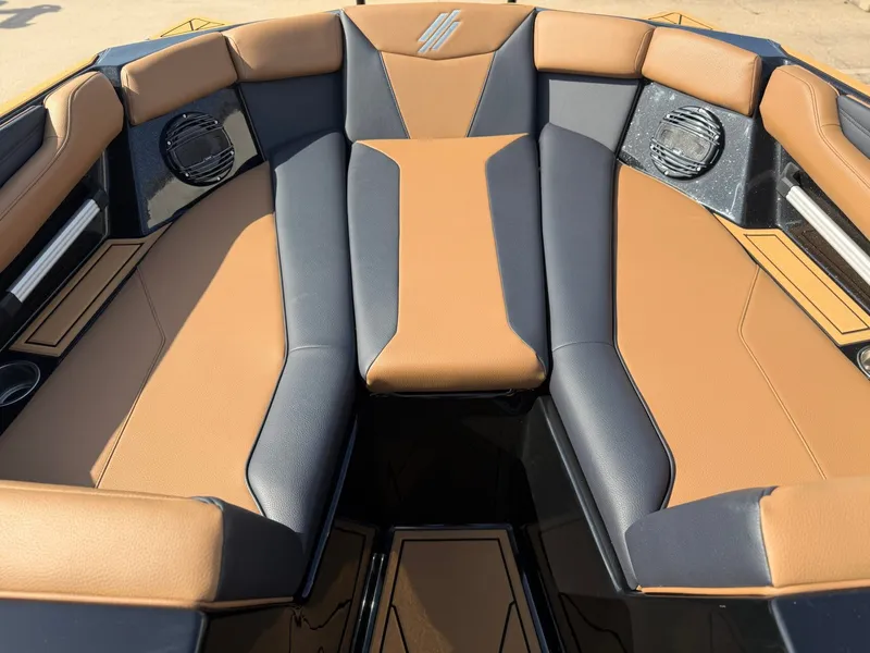 Slide: The Image of The image shows the bow of an ATX Surf Boats 22 Type-S with brown and black upholstery. - 17
