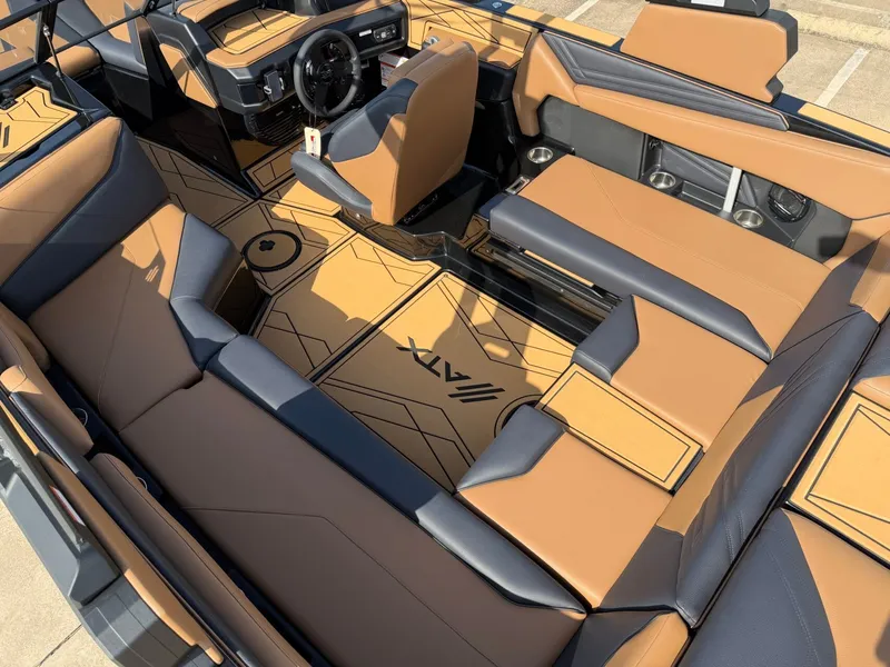 Slide: The Image of The image shows the interior of a 2027 ATX Surf Boats 22 Type-S with stylish seating. - 11