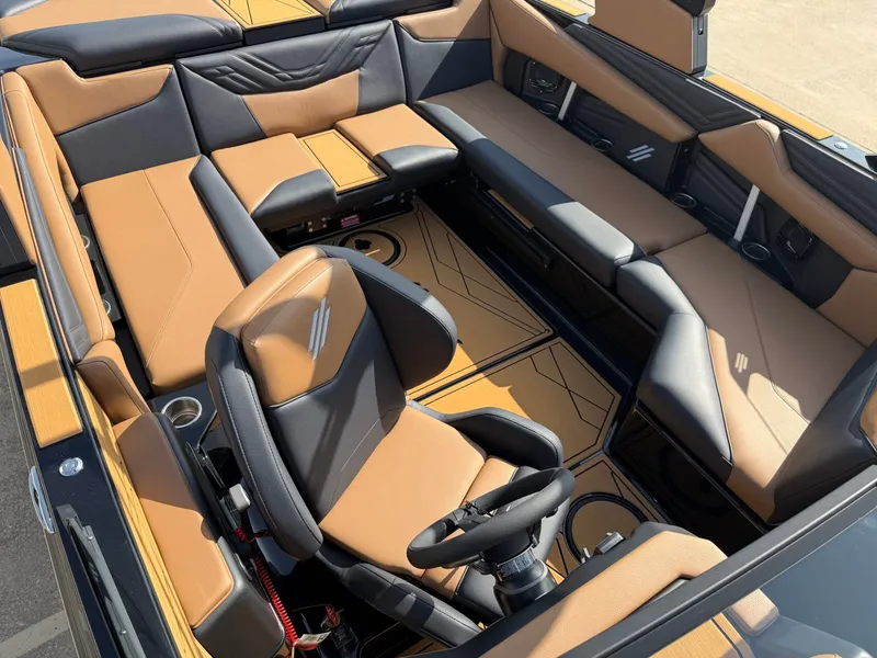 Slide: The Image of The image shows the interior of a 2027 ATX Surf Boats 22 Type-S with sleek brown and black seating. - 20