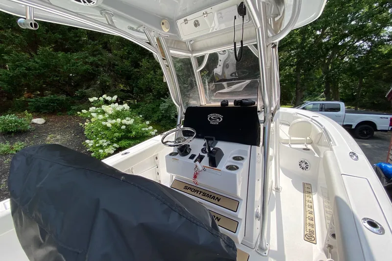 Slide: The Image of 2018 Sportsman Open 242 Center Console boat interior with steering wheel and seating. - 26