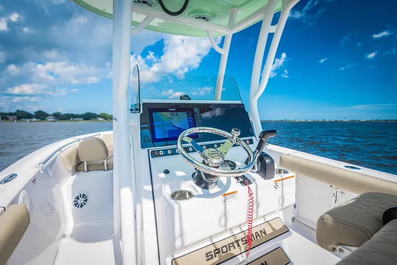 Slide: The Image of Manufacturer Provided Image: 2018 Sportsman Open 242 Center Console boat dashboard on a sunny day. - 17