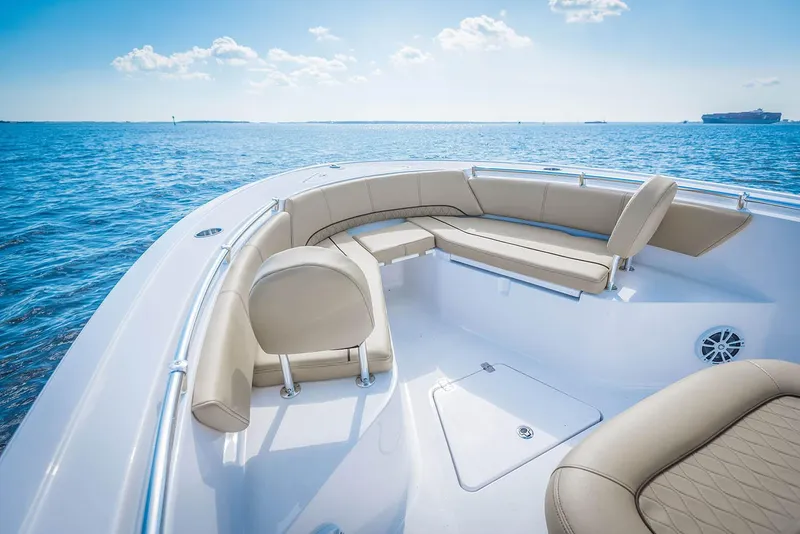 Slide: The Image of Manufacturer Provided Image: 2018 Sportsman Open 242 Center Console boat with spacious seating on the water. - 16