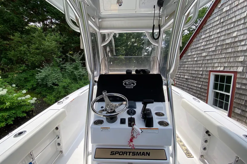 Slide: The Image of 2018 Sportsman Open 242 Center Console boat interior with steering wheel and controls. - 10