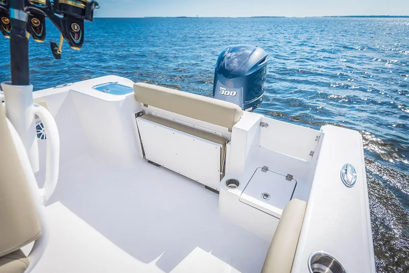 Slide: The Image of Manufacturer Provided Image: 2018 Sportsman Open 242 Center Console boat interior with Yamaha 300 engine on open water. - 19