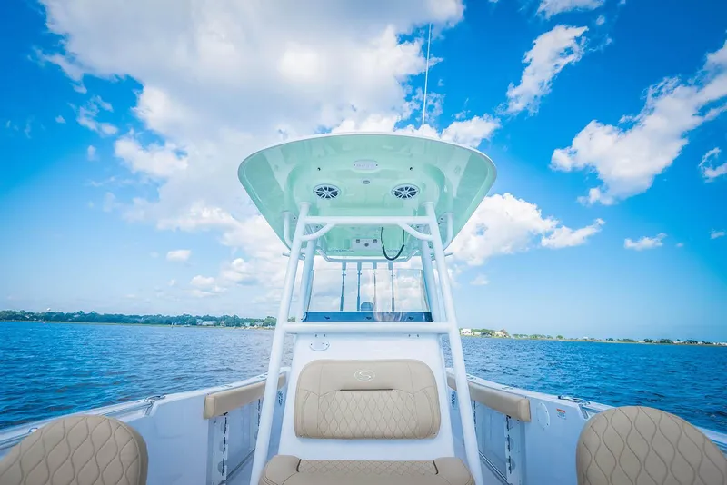 Slide: The Image of Manufacturer Provided Image: 2018 Sportsman Open 242 Center Console boat on a sunny day. - 18