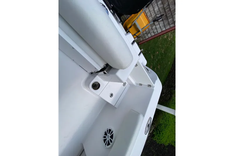Slide: The Image of 2018 Sportsman Open 242 Center Console boat interior with seating and speaker detail. - 27