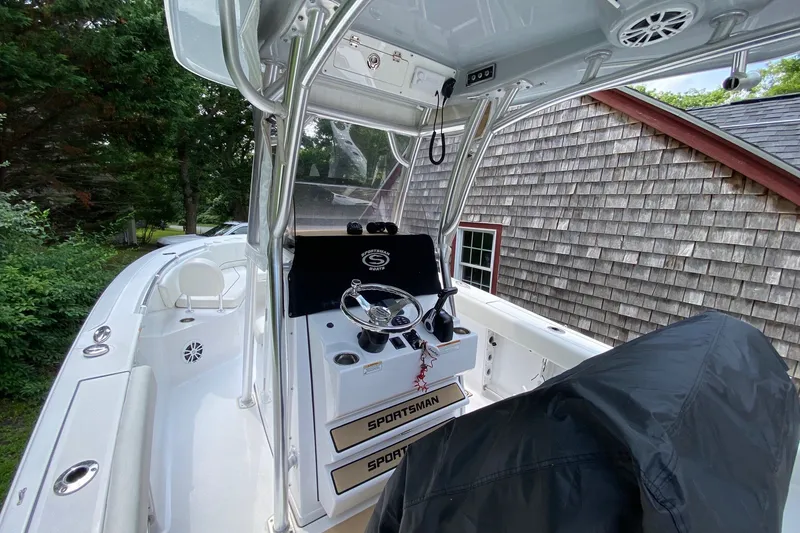 Slide: The Image of 2018 Sportsman Open 242 Center Console boat with sleek design and modern controls. - 9