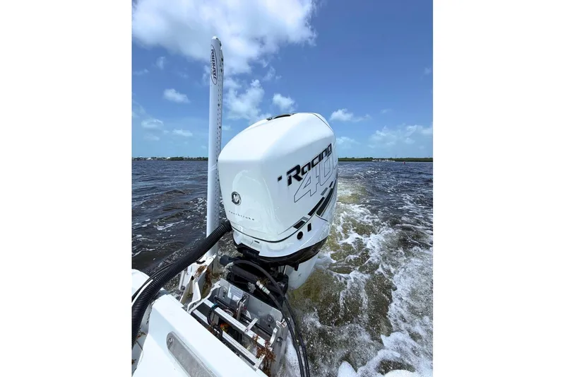 Slide: The Image of 2018 Yellowfin 26 Hybrid boat with powerful Racing 400 engine on open water. - 14