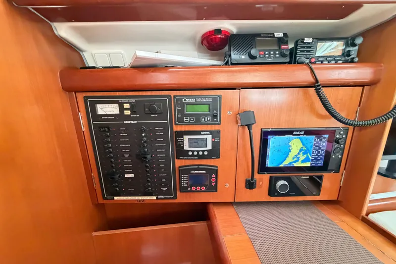 Slide: The Image of Control panel of a 2007 Beneteau 423 yacht with navigation and communication equipment. - 31