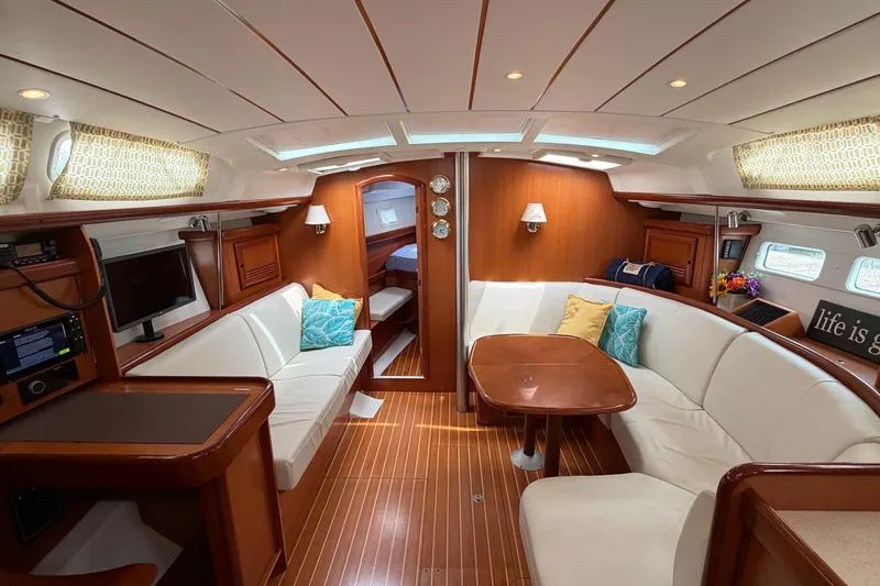Slide: The Image of Luxurious interior of a 2007 Beneteau 423 yacht with elegant wood finishes and cozy seating. - 25