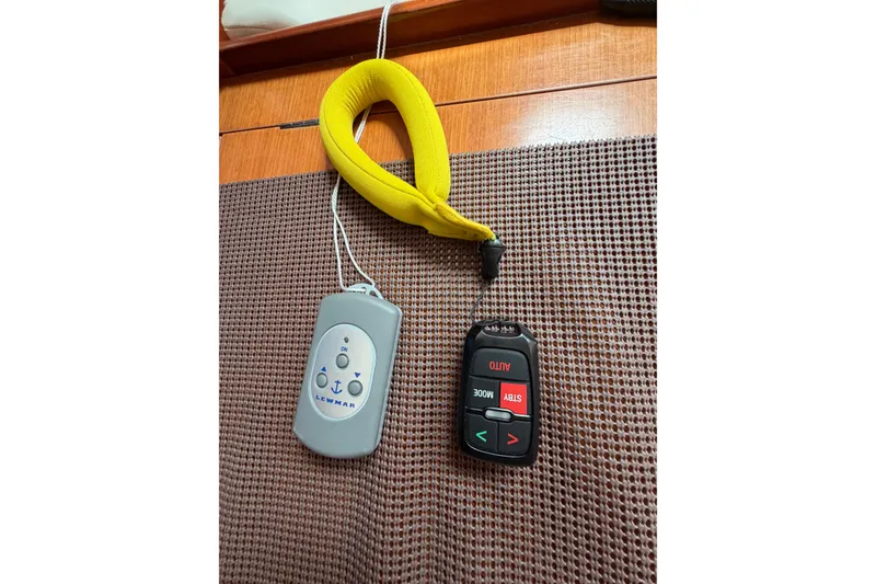 Slide: The Image of Remote controls hanging inside a 2007 Beneteau 423 yacht. - 58
