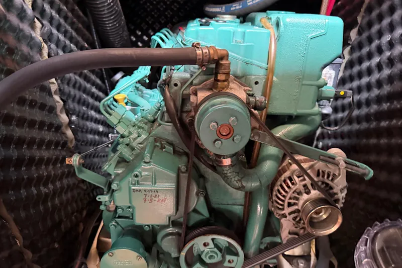 Slide: The Image of Engine of a 2007 Beneteau 423 sailboat, featuring detailed mechanical components. - 47