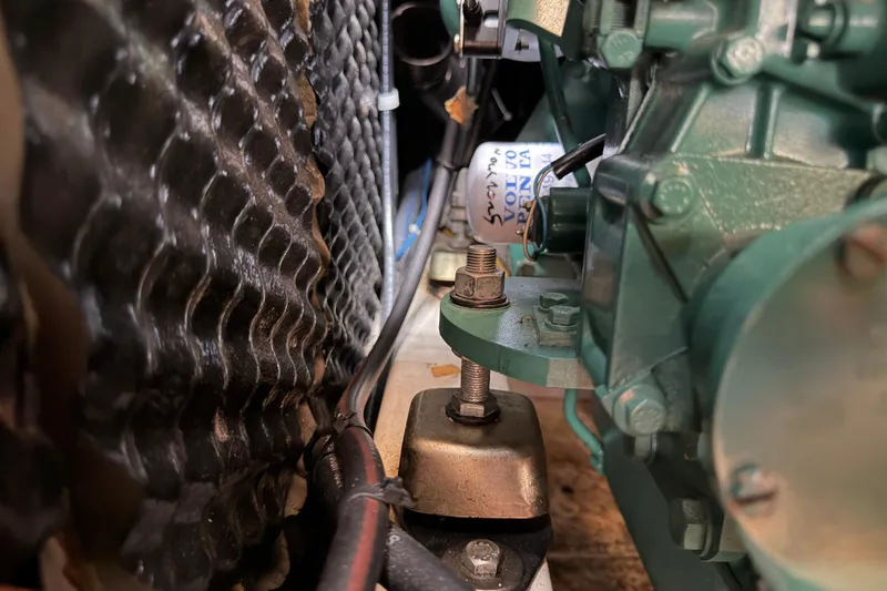 Slide: The Image of Engine compartment of a 2007 Beneteau 423 sailboat, showcasing mechanical components and wiring. - 49
